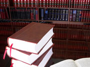 Picture of law library and open books.